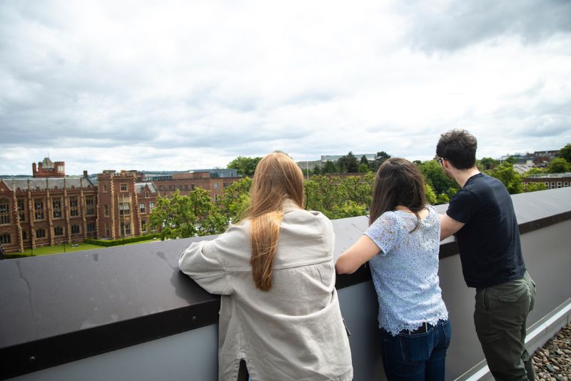 students standing on rooftop in One Elmwood looking at view